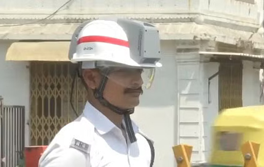 Traffic cop wearing AC helmet 